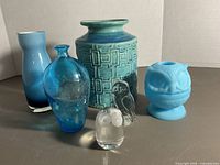 Group shot showing all three owls and three vases