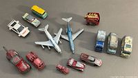 Full lot overview of 13 die-cast vehicles and planes