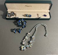 Full lot showing necklace, brooch, earrings and rings with Mappins case