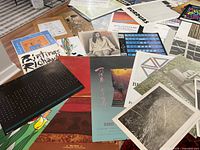 Overview of assorted posters spread on table
