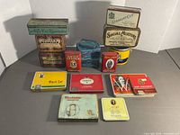 All tins arranged to show variety, sizes, and graphics
