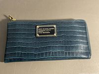 Front view showing croc embossing and logo plaque