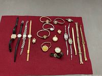 Full lot of mixed ladies wristwatches and straps on red felt