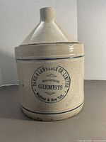 Front view of stoneware jug showing full form and logo