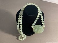 Necklace draped on bust showing overall appearance