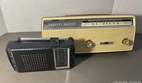 Front view of both radios, showing Channel Master grille and Realtone case