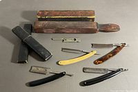 Overall lot showing strop, razors, trimmer and cases