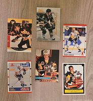 All six Mario Lemieux trading cards laid out