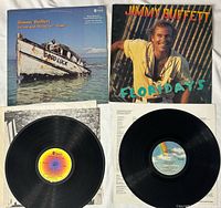 Front jackets and both vinyl records visible