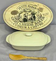 Full set showing oval wood box lid, cream baker with lid and wooden spreader
