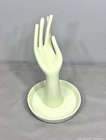 Front view of ceramic hand jewelry stand