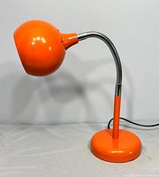Full view of orange eyeball lamp front view