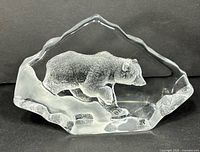 Front view of Mats Jonasson crystal paperweight showing grizzly bear design