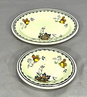 Top view of both Mayflower pattern pieces showing floral decoration and shape