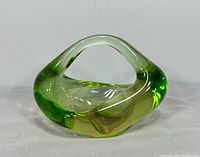 Front view of green glass sculpture bowl