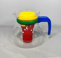 Front view showing glass body, colored components