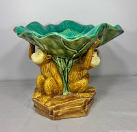 Front view showing leaf bowl and two supporting monkeys