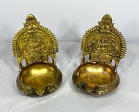 Front view of both brass Lakshmi oil lamps