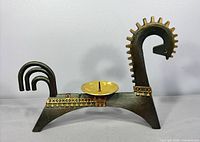 Full left-side view of horse candle holder