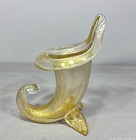 Right side view of cornucopia vase showing gold leaf inclusions and curled tail