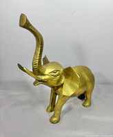 Full view of brass elephant figurine front left