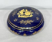 Top view showing cobalt glaze and gold courting scene