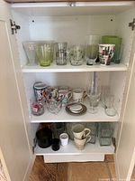 Cabinet showing all three shelves of items