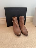 Front view of both boots with box