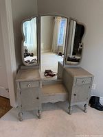 Front view showing full vanity with mirrors and cabinets