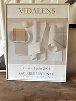 Full view of framed poster showing artwork, frame, and text