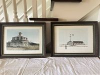 Both framed prints side by side on table