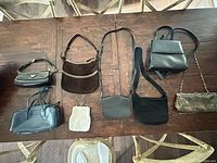 All eight bags displayed on table for overview