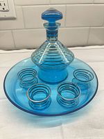 Full set showing decanter, four cups, tray