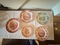 Overhead view showing all five transferware plates