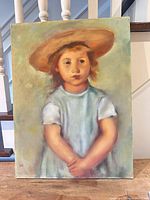 Full view of framed oil painting of child