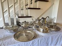 Overall view of 14-piece silver-plated tea and serving set on table