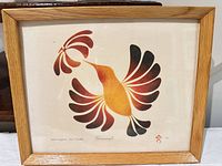 Full view of framed serigraph showing stylized hummingbird and flower