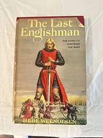 Dust jacket front showing title, author, illustration, visible tear at corner