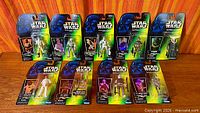 Group shot of nine mint-on-card Star Wars Power of the Force figures arranged in two rows