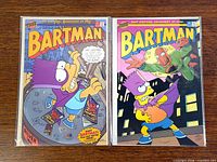 Front covers of Bartman issues #1 and #2 in bags and boards