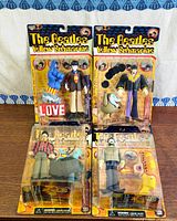 Front view of all four sealed figures on blister cards