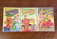 Front covers of all three bagged and boarded comics
