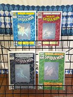 Front view of all four bagged hologram comics on rack