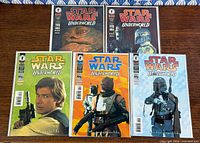 All five bagged comics laid out showing full covers.