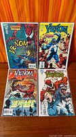 All four Venom: Carnage Unleashed comics laid out, bagged and boarded