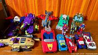Group shot of all Transformers figures and vehicles