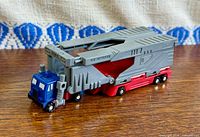 Side view of truck trailer attached to blue cab