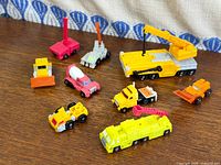 Group view of all nine Micromaster vehicles spread on tabletop