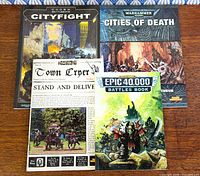 Front covers of all four books laid out on table