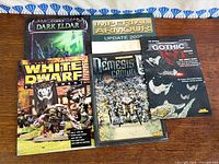 Front covers of all five Warhammer books laid out